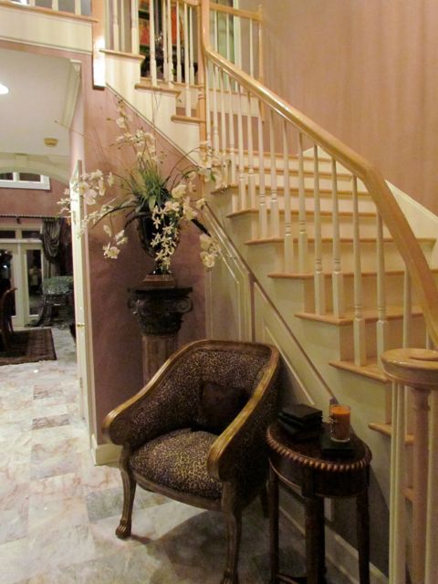 Foyer with curved staircase.